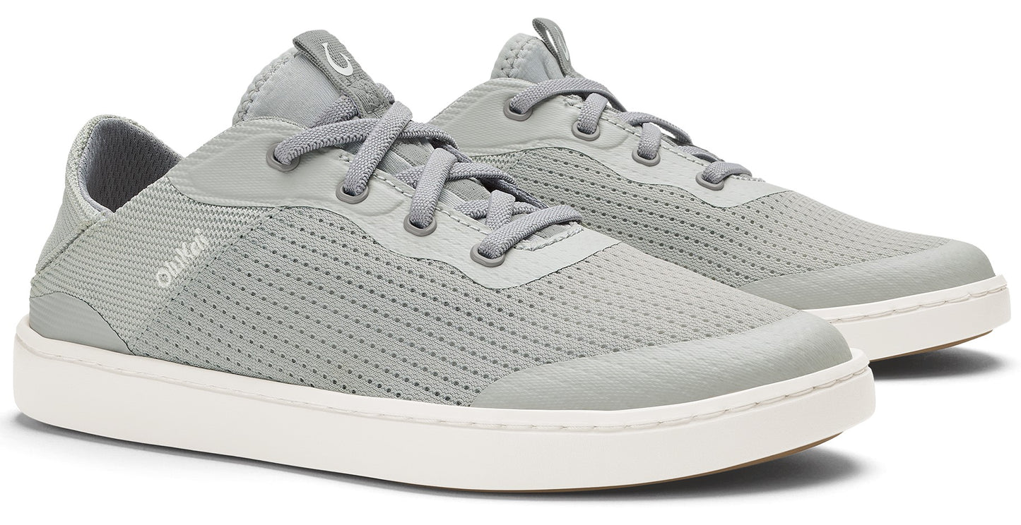 A pair of gray sneakers with white soles and visible laces.