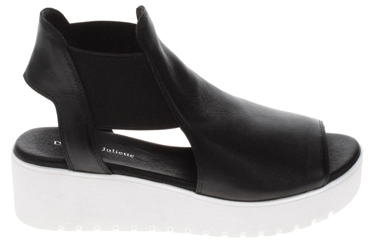 Black open-toe shoe with thick white sole and "Juliette" imprint.