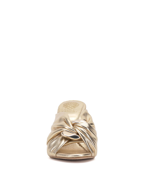 Gold color women's mule with a knotted design in the front