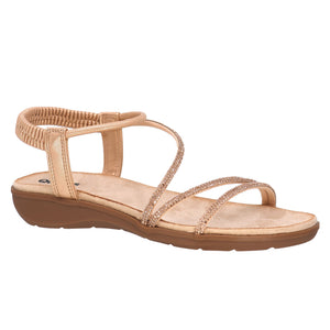 Tan sandal with elastic ankle strap and thin, crossed straps.