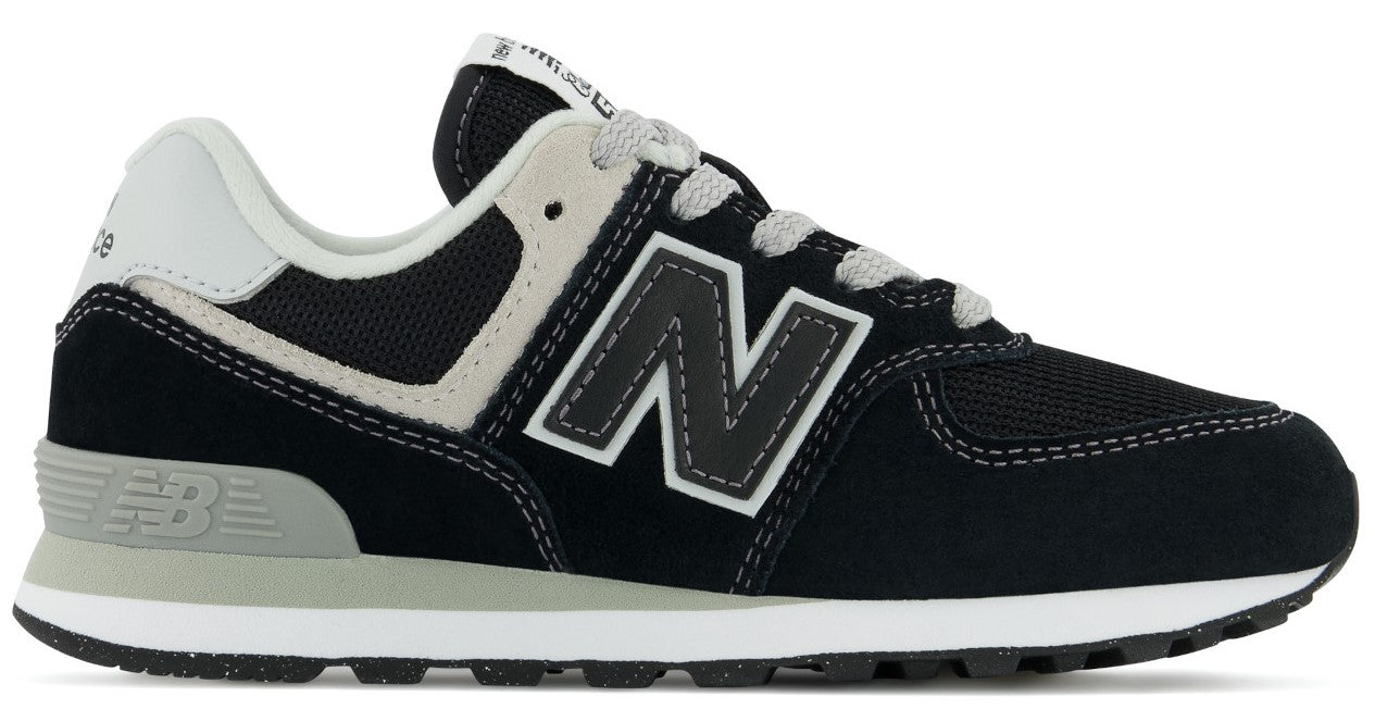 Black and white athletic shoe with gray laces and a large N on the side.