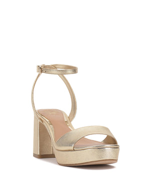 Gold platform heeled sandal with an ankle strap.