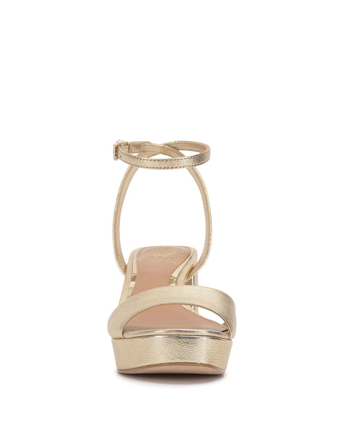 Front view of a gold platform sandal with a thin ankle strap.