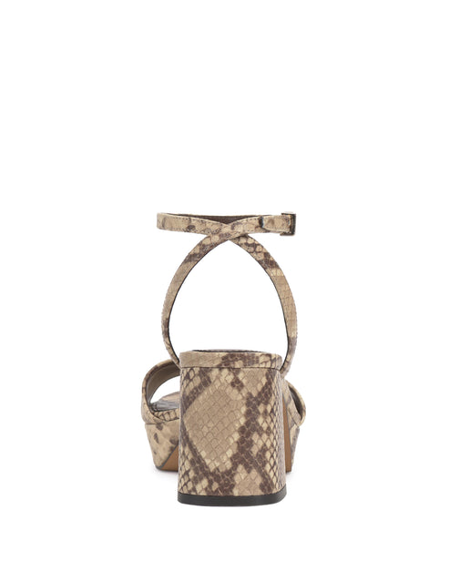 Back view of a snakeskin print platform heel sandal with an ankle strap.