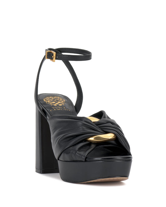Black leather platform sandal with gold hardware and ankle strap.