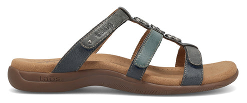 A three-strapped leather sandal with decorative embellishments.