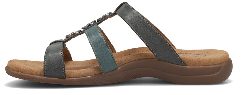 A sandal with gray straps.
