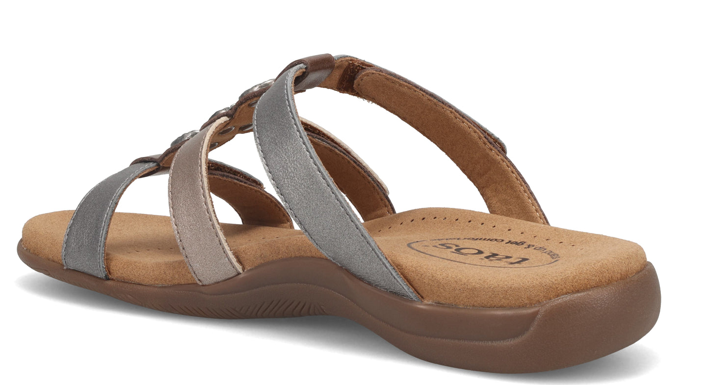 A sandal with three metallic-colored straps across the top and an open toe.