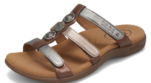 Slide sandals with copper sole and silver straps, one with three decorative silver circles, and the brand name.