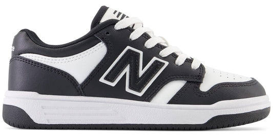 A black and white sneaker with a large letter N on the side and white laces.