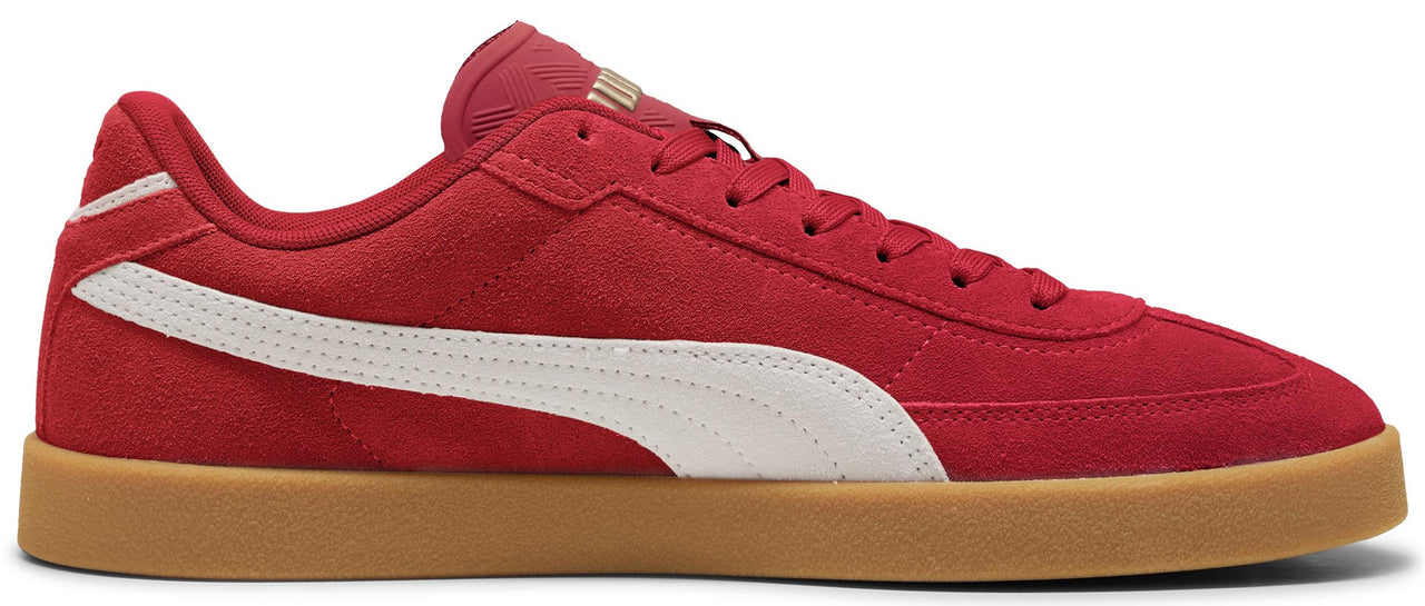 A red sneaker with a white stripe and a tan sole.