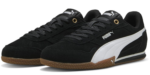 A pair of low-top black sneakers with white side stripes, a brown sole, black laces and 'PUMA' printed on the side.