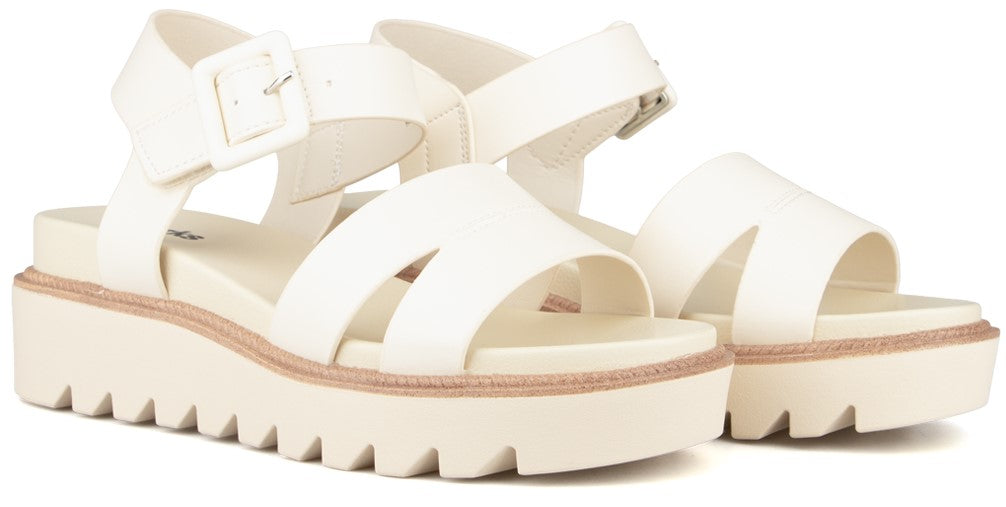 White platform sandals with thick sole and buckle straps.