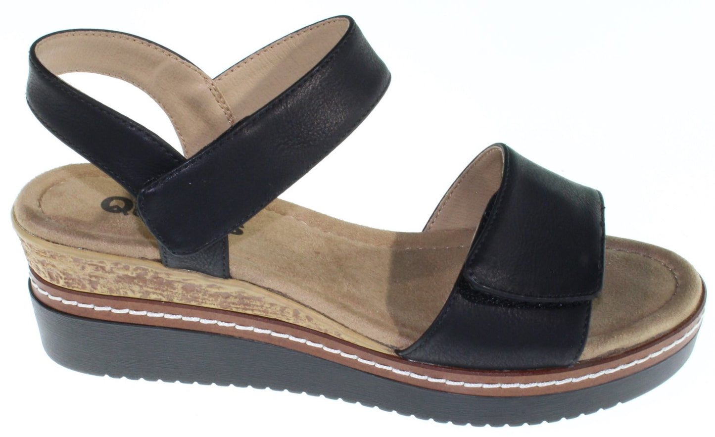 Black leather platform sandals with velcro straps.