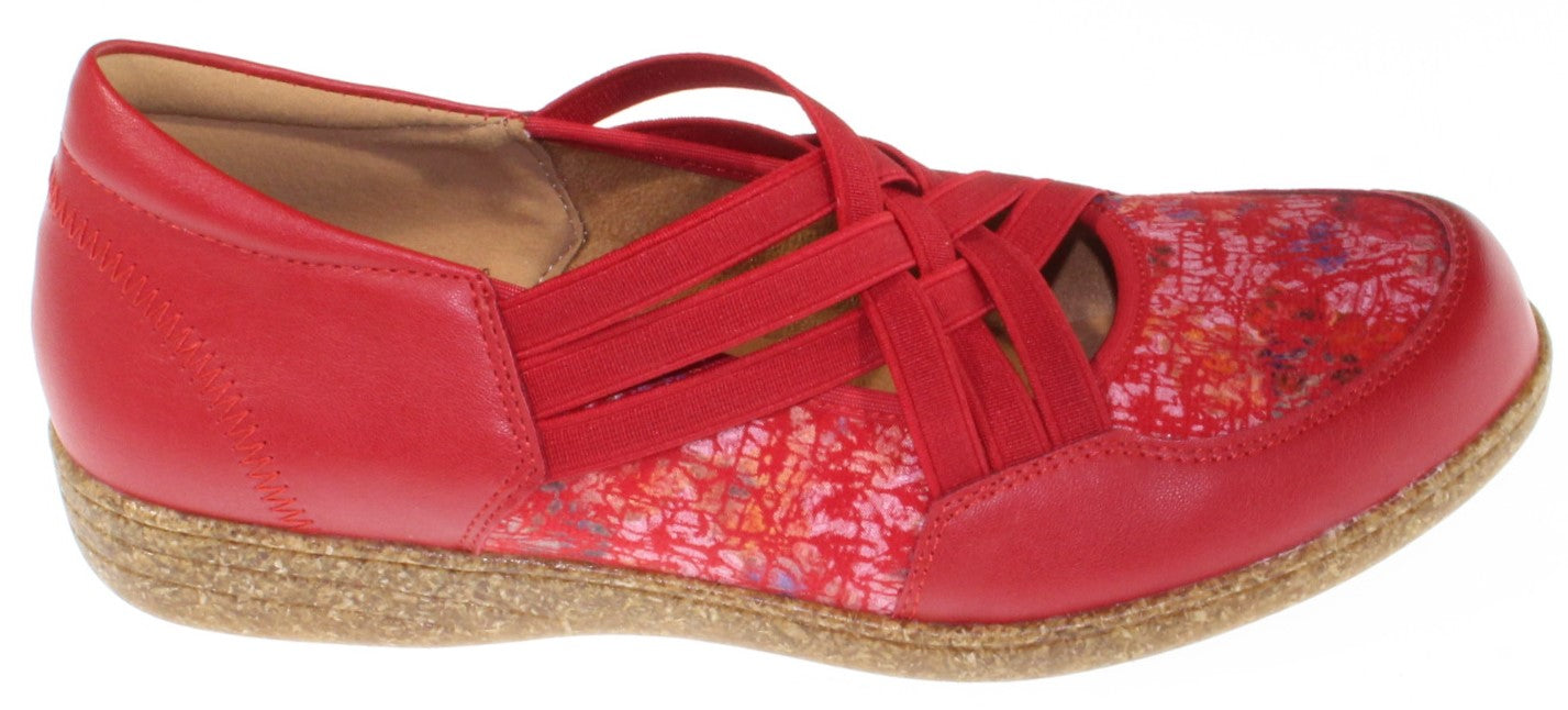 A red shoe with criss-cross straps and floral panels.