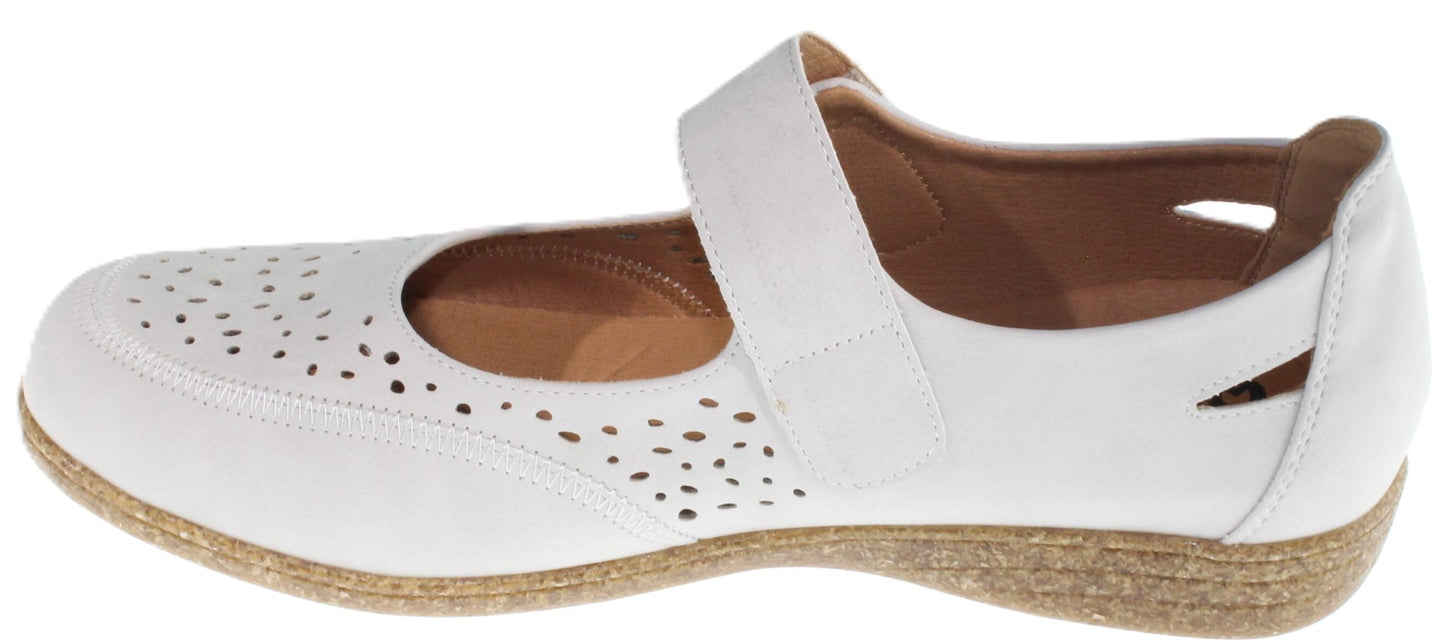 White Mary Jane shoe with decorative cutouts.