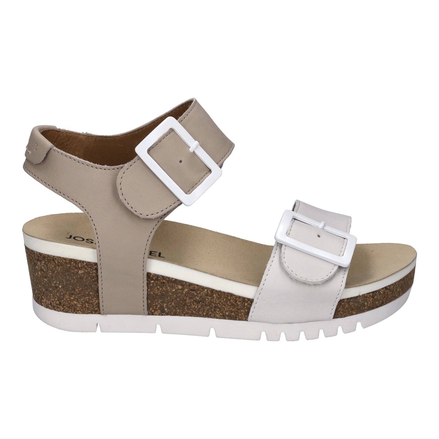 Beige sandal with white buckles and cork platform sole.
