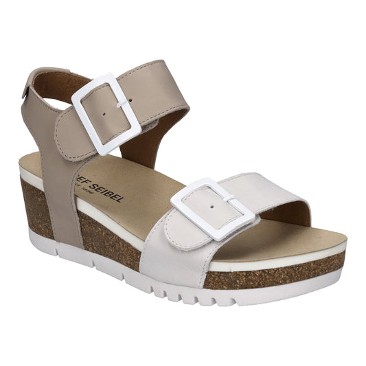 Light beige and white wedge sandal with two straps, each with a white buckle.