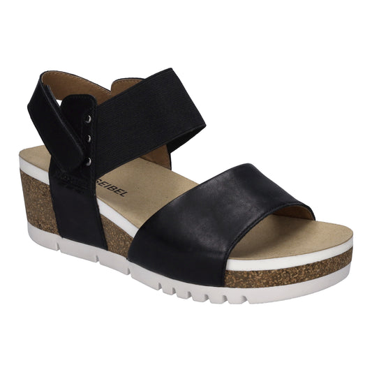 Black leather sandal with cork wedge heel and white sole.