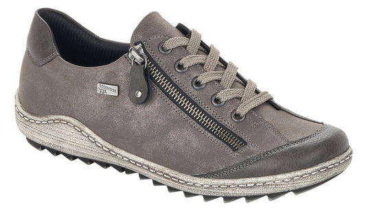 A gray low-top shoe with laces and a side zipper.
