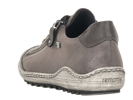 Low-profile gray shoe with a decorative zipper and white stitching around the sole, 'remonte' is printed on the sole.
