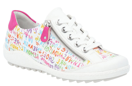 A white sneaker with colorful graffiti print, pink heel accent, and a side zipper.