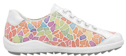 A white shoe with a colorful mosaic design.