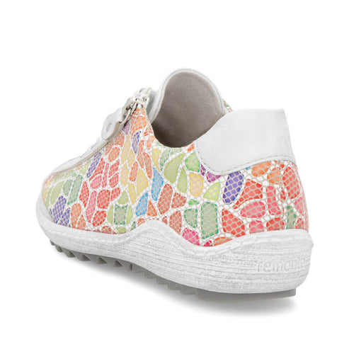 A colorful women's shoe with a mosaic pattern, white heel and sole, and a partial zipper.