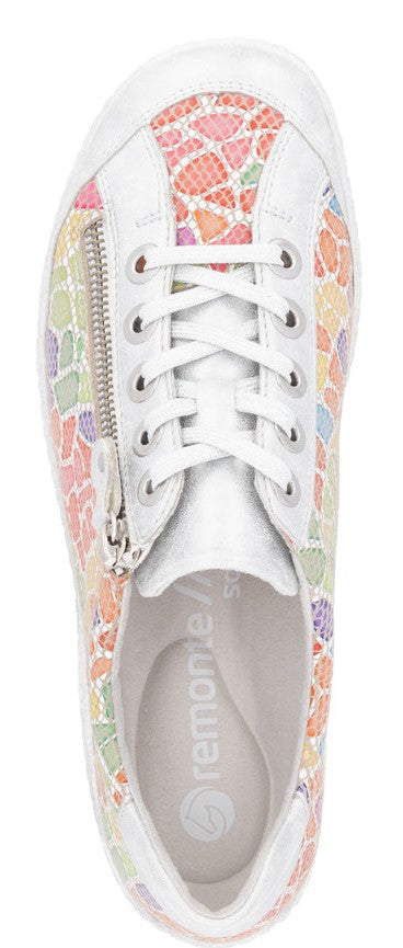 A patterned sneaker with white laces and a side zipper, as seen from above.
