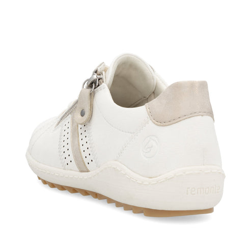 White sneaker featuring a zipper with a tan heel.
