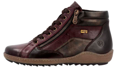 High-top sneaker with brown laces, side zipper, and dark color-blocked leather.