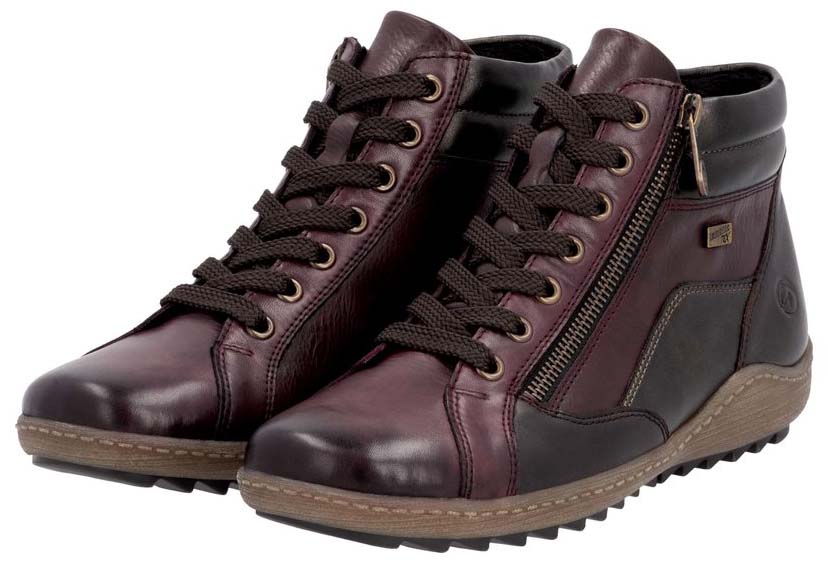 Pair of burgundy leather ankle boots with laces and side zippers.
