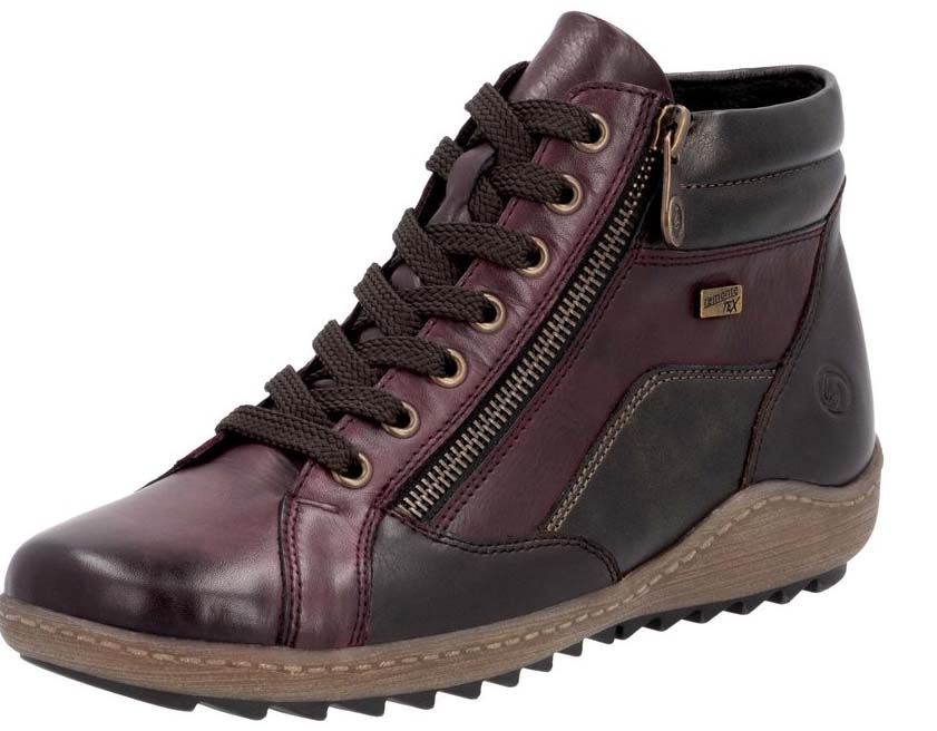 A high-top, lace-up, leather boot with a zipper running the length of the side of the boot.