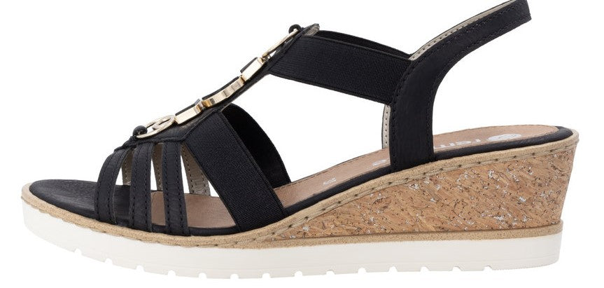 A black sandal with a wedge heel and white sole.