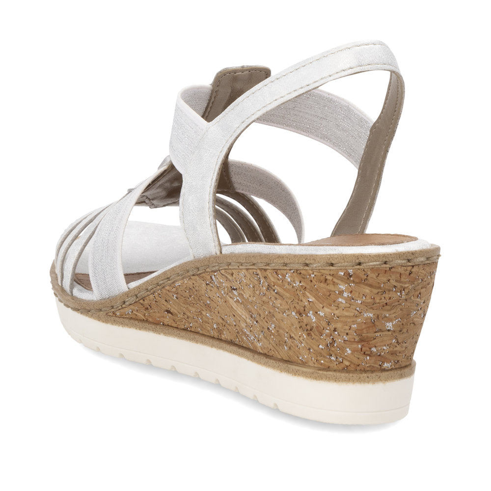 White sandal with cork wedge and white sole.