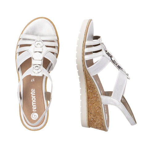 Pair of white wedge sandals, one from above, one on its side, with multiple horizontal straps across the front and a strap around the ankle, size 37.