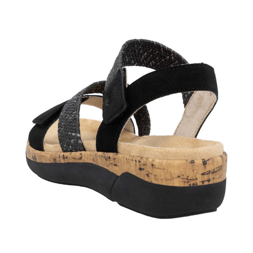 A black, slingback sandal with braided fabric straps and a cork midsole.