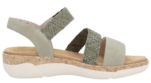 Sandal with green elastic and suede straps, cork footbed, and white sole.