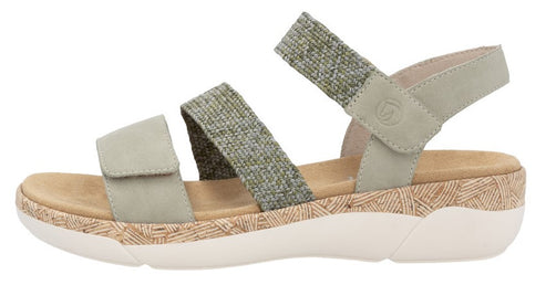 A light-green sandal with two adjustable straps, one leather and one patterned.