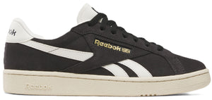 Black athletic shoe with white stripe and off-white sole.