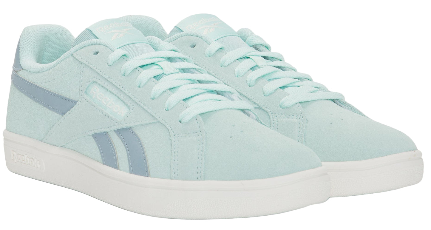 Light green sneakers with white soles and light blue stripes.