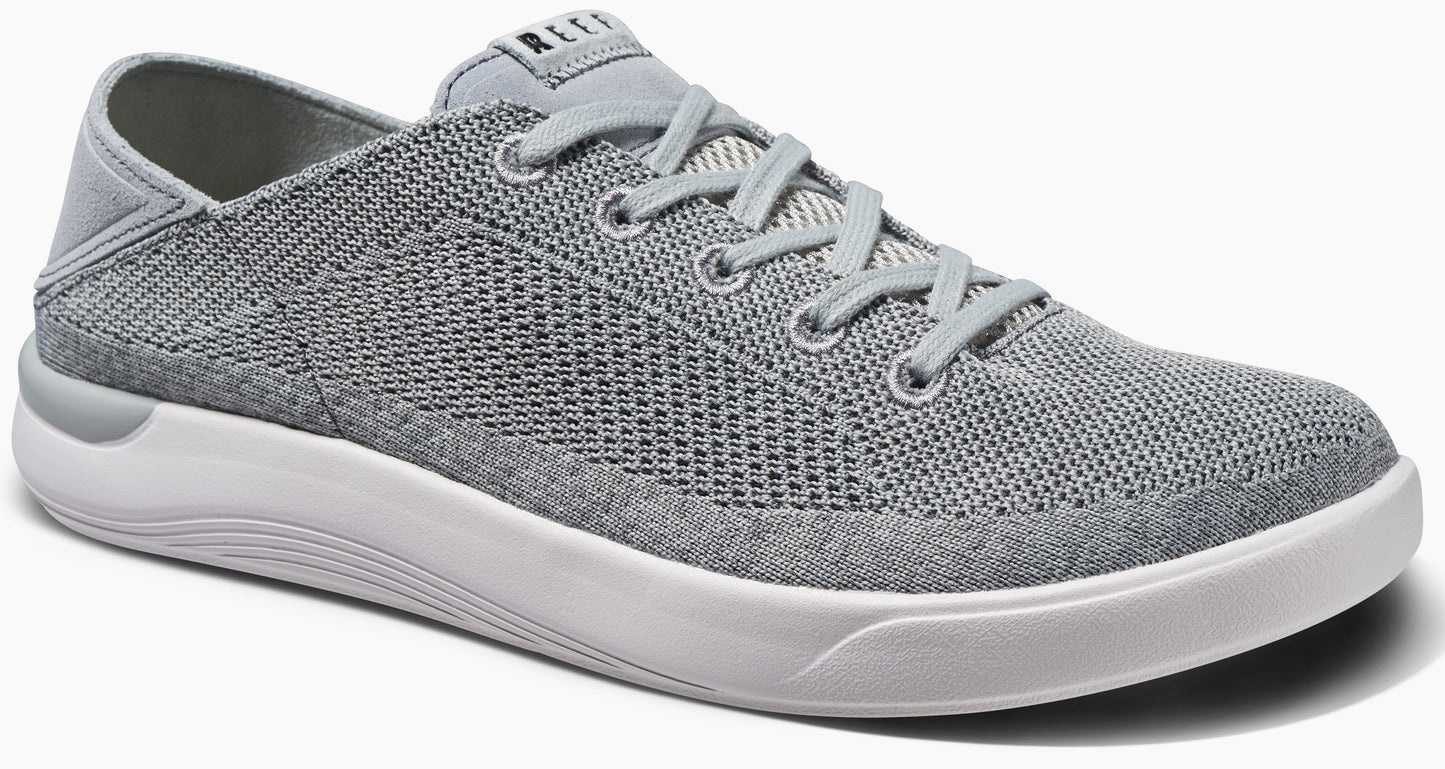 Gray low-top sneaker with knit upper and white sole.