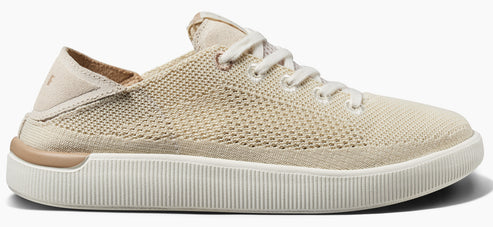 A neutral-toned low-top sneaker with a knitted upper and white laces.