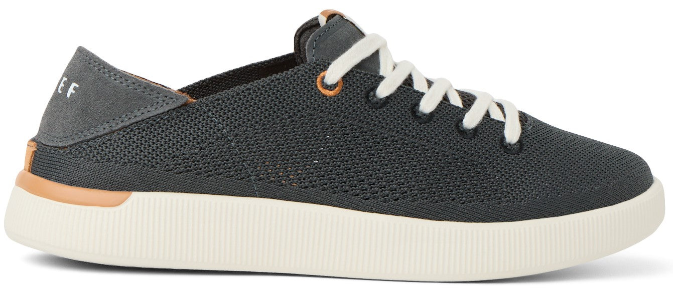 A gray sneaker with white laces and a thick white sole.