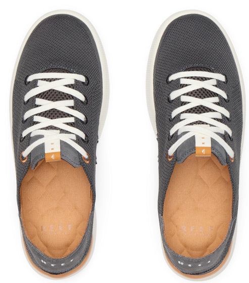 Pair of gray mesh low-top sneakers with white laces, light tan insoles, and white outsoles viewed from above.