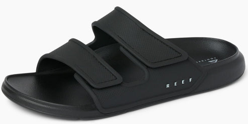 Black adjustable slide sandals with two velcro straps and white text "REEF".