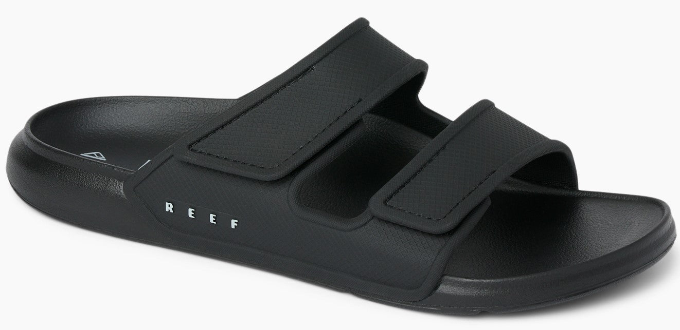Black slide sandals with two adjustable straps.