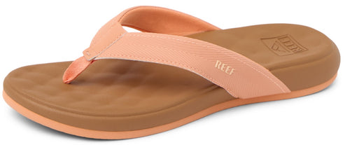 A sandal with a peach strap and a brown sole.