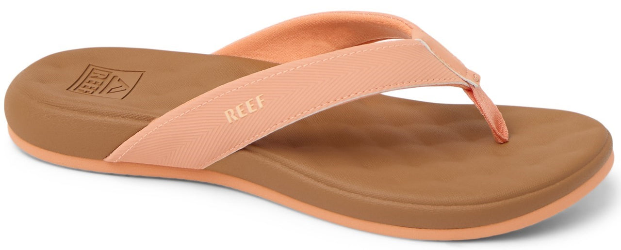 A peach colored flip-flop with a brown sole.