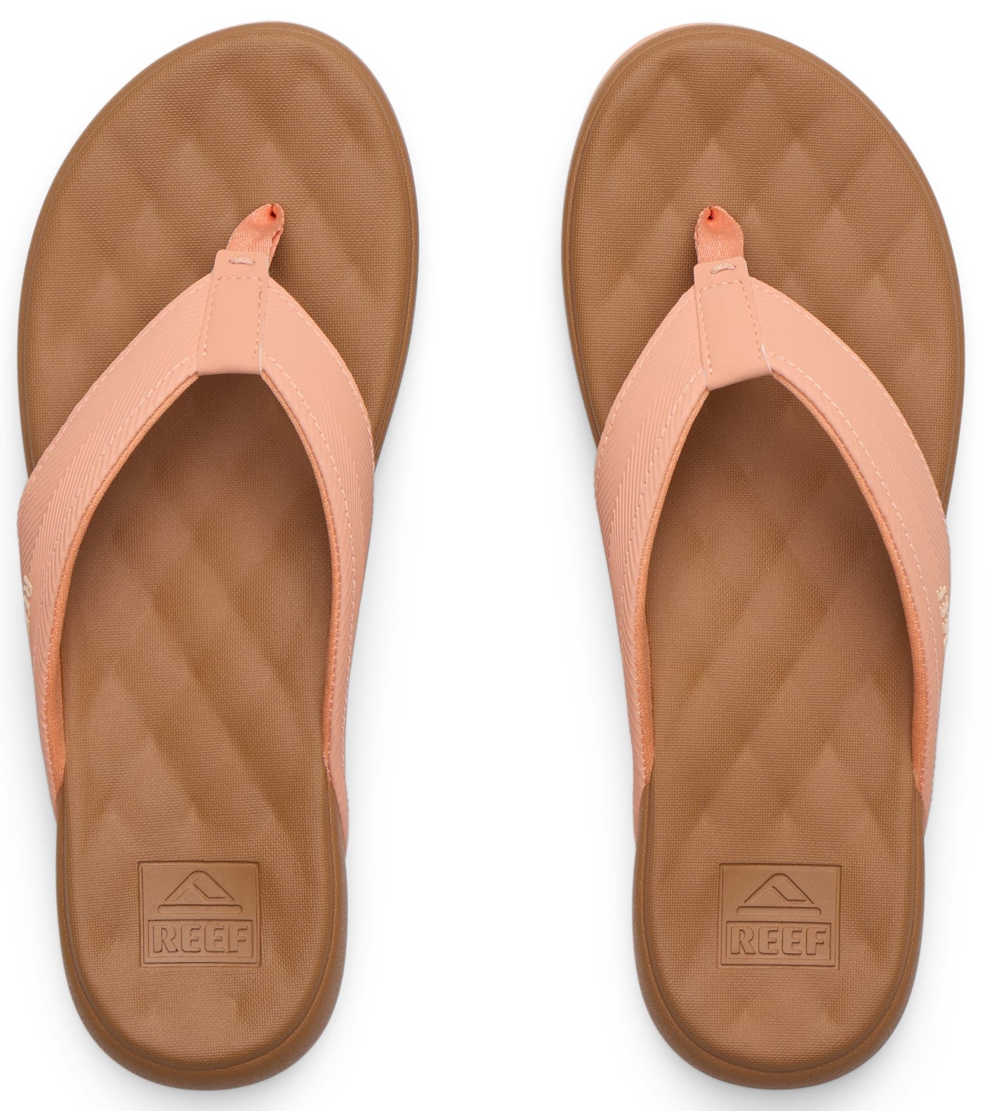 Pair of coral flip-flops with diamond-patterned tan soles and matching coral straps.
